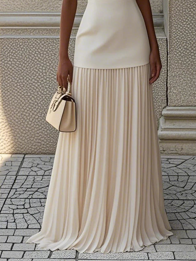 Luna | Vestido largo bicolor con falda plisada – minimalismo con estilo