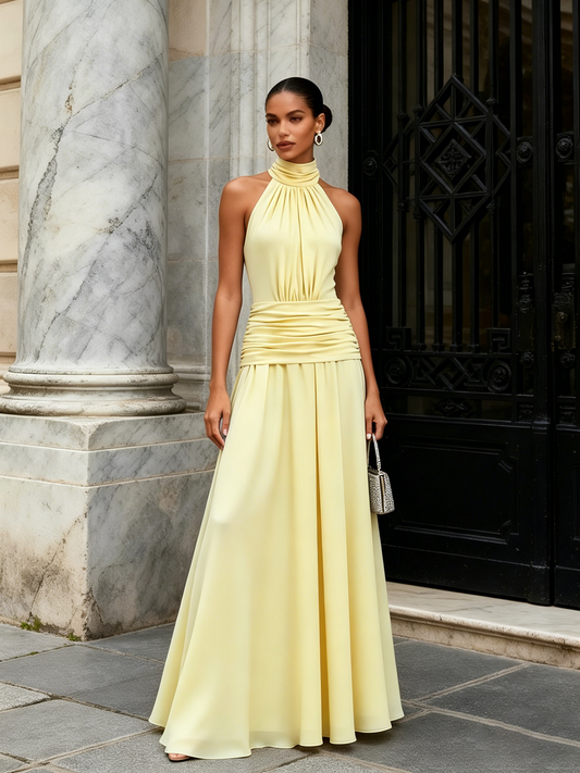 Sole | Vestido largo amarillo con cuello halter y lazo – elegancia atemporal